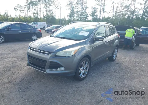 2014 Ford Escape Titanium z USA, uszkodzony, nr VIN 1FMCU0JX7EUC64583